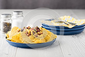 Beef nachos with jalapeno, olives, tomato, beans cheddar cheese