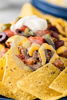 Beef nachos with jalapeno, olives, tomato, beans cheddar cheese