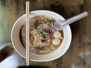 Beef noodles with meatballs and various vegetables. Popular Thai food, street food