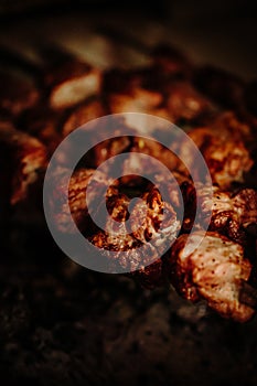 Beef pork shish kebabs roasting on the grill closeup. smoky meat, bbq party. outdoor recreation, vacation. vertical photo,