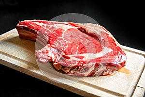 Beef prime rib on a cutting board