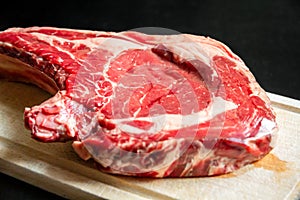 Beef prime rib on a cutting board