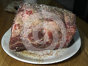 Beef prime rib roast in stages of preparation