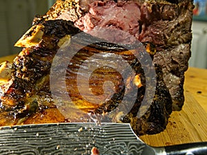 Beef prime rib roast in stages of preparation