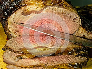 Beef prime rib roast in stages of preparation