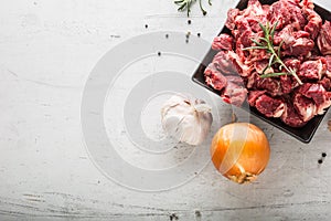 Beef. Raw sliced beef meat garlic onion salt pepper and rosemary