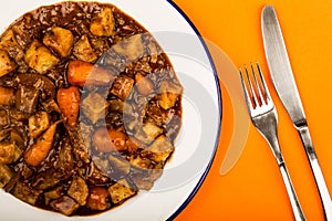 Beef and Red wine Casserole With Roast Potatoes Carrots and Mush
