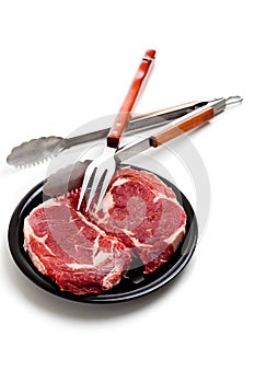 Beef Ribeye Steak and cooking utensils