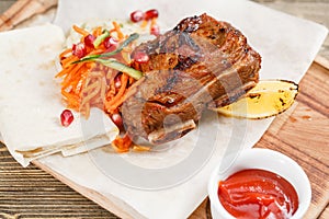 Beef ribs grill. Serving on a wooden Board on a rustic table. Barbecue restaurant menu, a series of photos of different