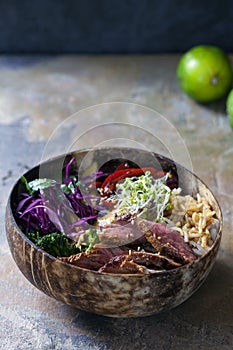 Beef with rice, red cabbage and broccoli