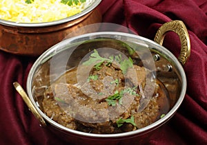 Beef rogan josh in a a balti dish photo