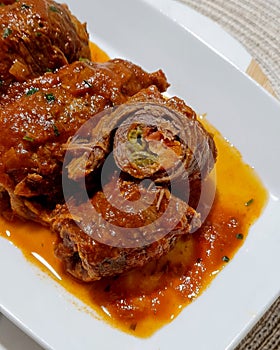 Beef rolls in delicious tomato sauce. Brazilian \