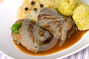 Beef Roulade with Dumplings,Cabbage (Sauerkraut) a photo