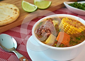 Beef sancocho typical dish from venezuela, soup with meat and vegetables photo