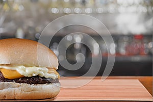 beef sandwich hamburger with salad and cheese on the table with blurred background photo