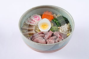 Beef shoyu ramen on white background, beef with japanes
