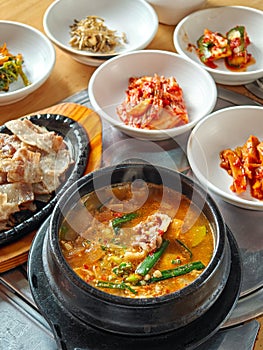 Beef soy bean paste soup, grilled sliced beef and side dishes. Typical Korean food