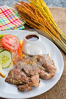 Beef steak with black pepper sauce , salad and French fries on s