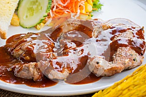 Beef steak with black pepper sauce , salad and French fries on s