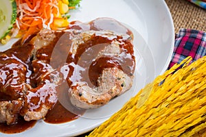 Beef steak with black pepper sauce , salad and French fries on s