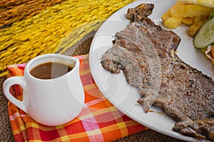 Beef steak with black pepper sauce , salad and French fries on s