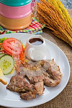 Beef steak with black pepper sauce , salad and French fries on s