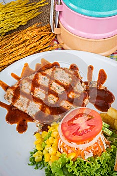 Beef steak with black pepper sauce , salad and French fries on s