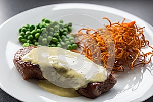 Beef steak with green peas and sweet potato