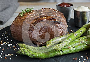 Beef steak grilled with asparagus tomatoes spice and sauce