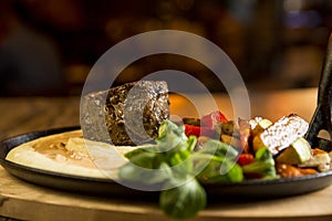 Beef steak with mashed potatoes and grilled vegetables