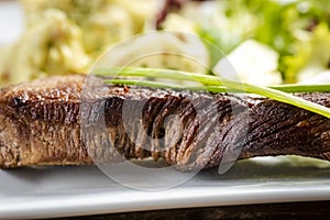 Beef steak with mashed potatoes and rocket salad