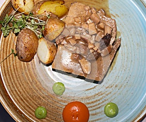 beef steak with mushroom sauce and new potatoes