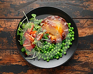 Beef steak pies with rich onion gravy served with sweet peas and salad