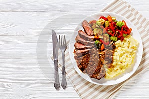 Beef steak with potato mash and roasted vegetables