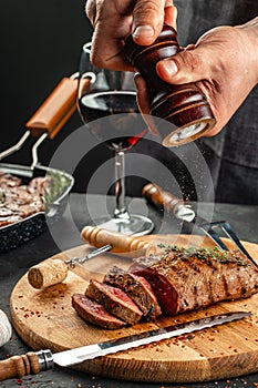 Beef steak and red wine. Grilled meat on wooden cutting board. Banner, menu, recipe place for text, top view