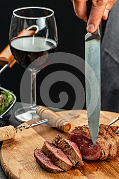 Beef steak and red wine. Grilled meat on wooden cutting board. banner, menu, recipe place for text, top view