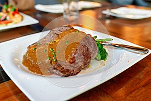 Beef steak rib eye australia grilled with ripeness medium rare with pepper sauce
