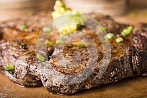 Beef steak served with mashed potato and gravy with melting butter