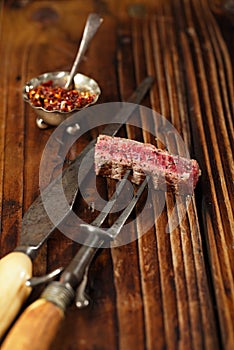 Beef steak Slice on vintage meat fork