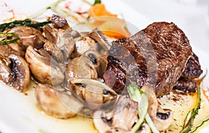 Beef steak with tasty mushrooms and truffle oil