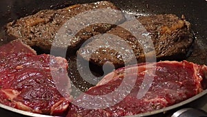 Beef steaks are cooking in the pan, contains plenty of protein