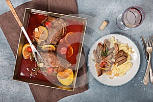 Beef stew with mashed potatoes and glass of red wine