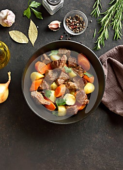 Beef stew with potatoes, carrots and greens