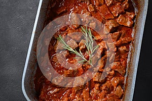 Beef stew with rosemary in a bowl