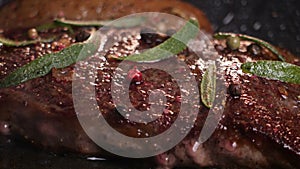 Beef strip loin steak in a frying pan