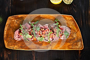 Beef Stroganoff with lemon on a plate jpg