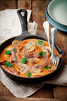 Beef Stroganoff with mushroom in iron pan