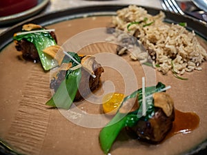 Beef sweet soya sauce decorated on dish in fining cuisine restaurant