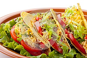Beef tacos with salad and tomatoes salsa