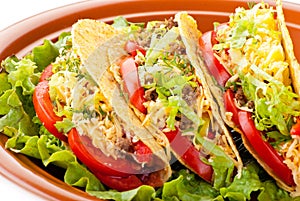 Beef tacos with salad and tomatoes salsa